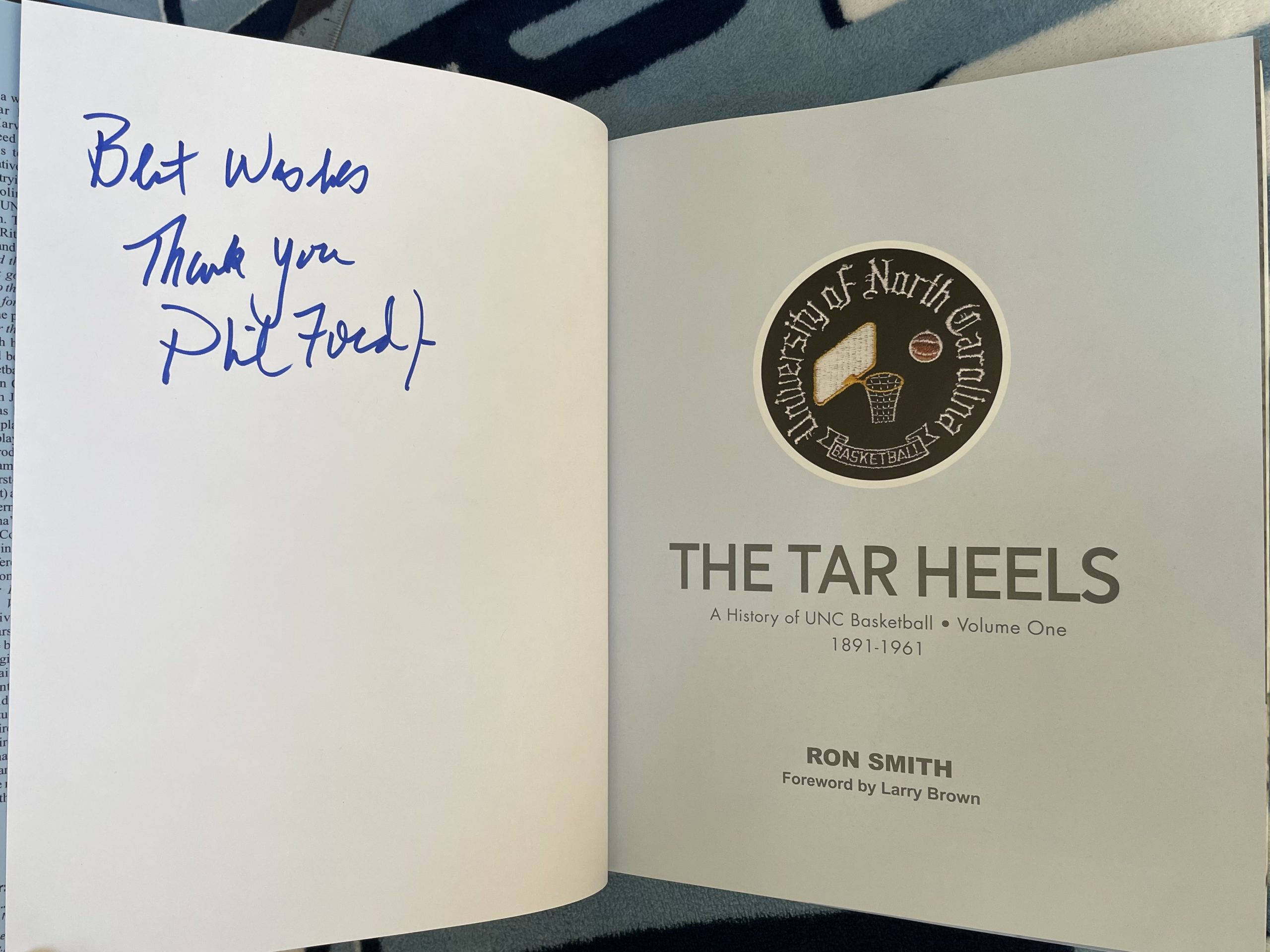 3/29/22 GiveUNC Raffle for The Tar Heels, Vol 1 signed by Phil Ford